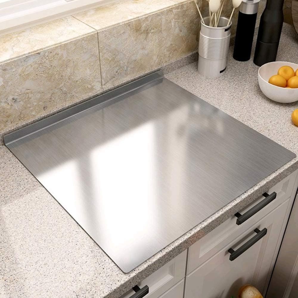 Stainless steel prep board fitted on a kitchen counter